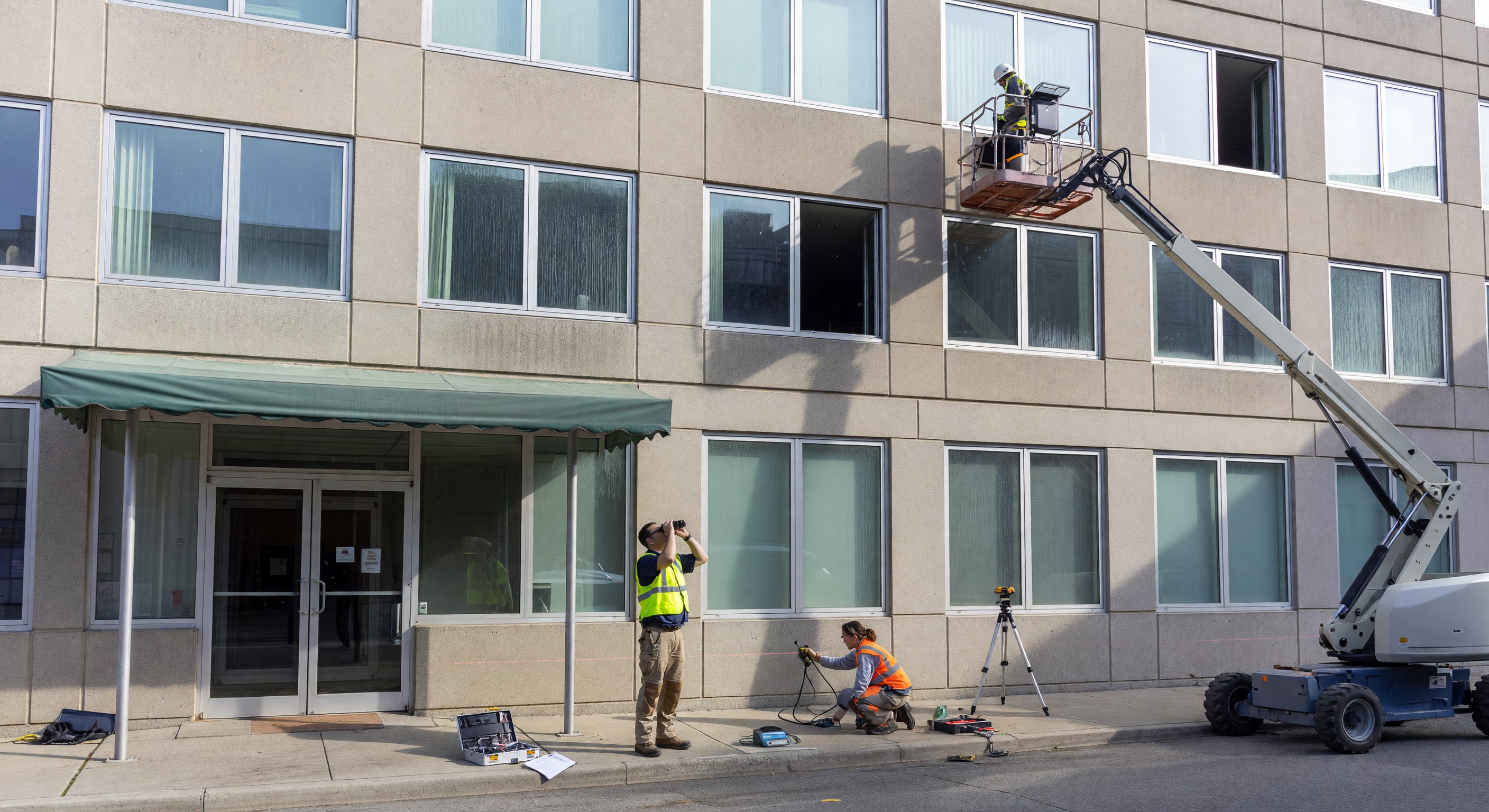 Exterior facade of a hotel building under inspection