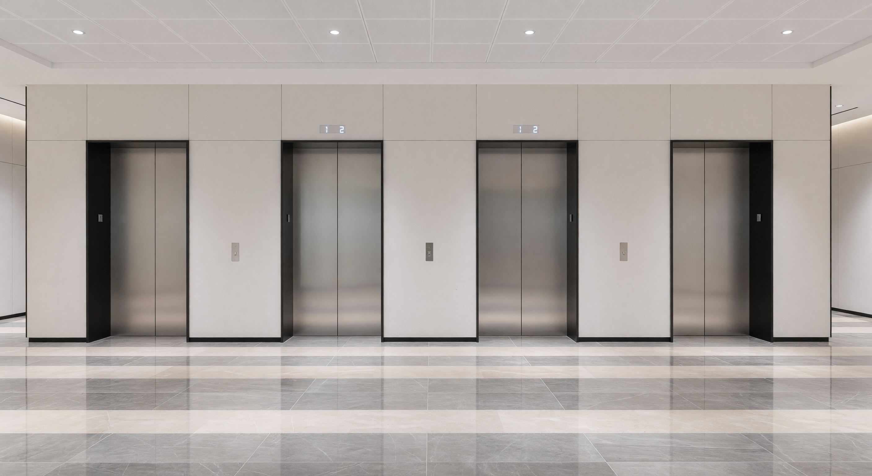 Hotel elevator lobby with multiple elevator doors