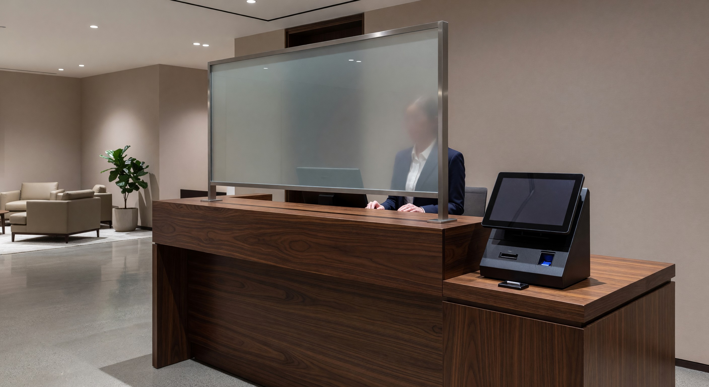 Hotel front desk with privacy screen and secure check-in environment